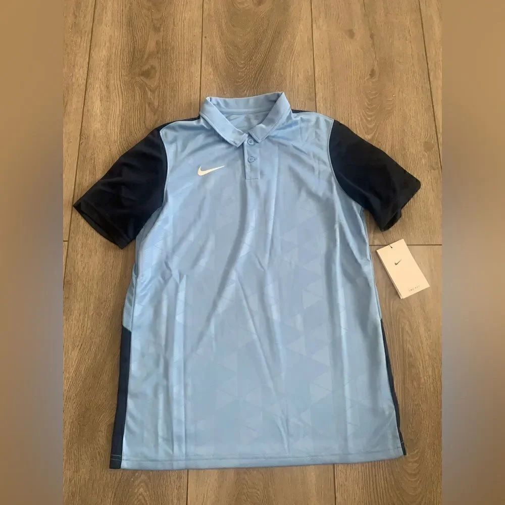 Nike youth unisex football/soccer polo shirt.
